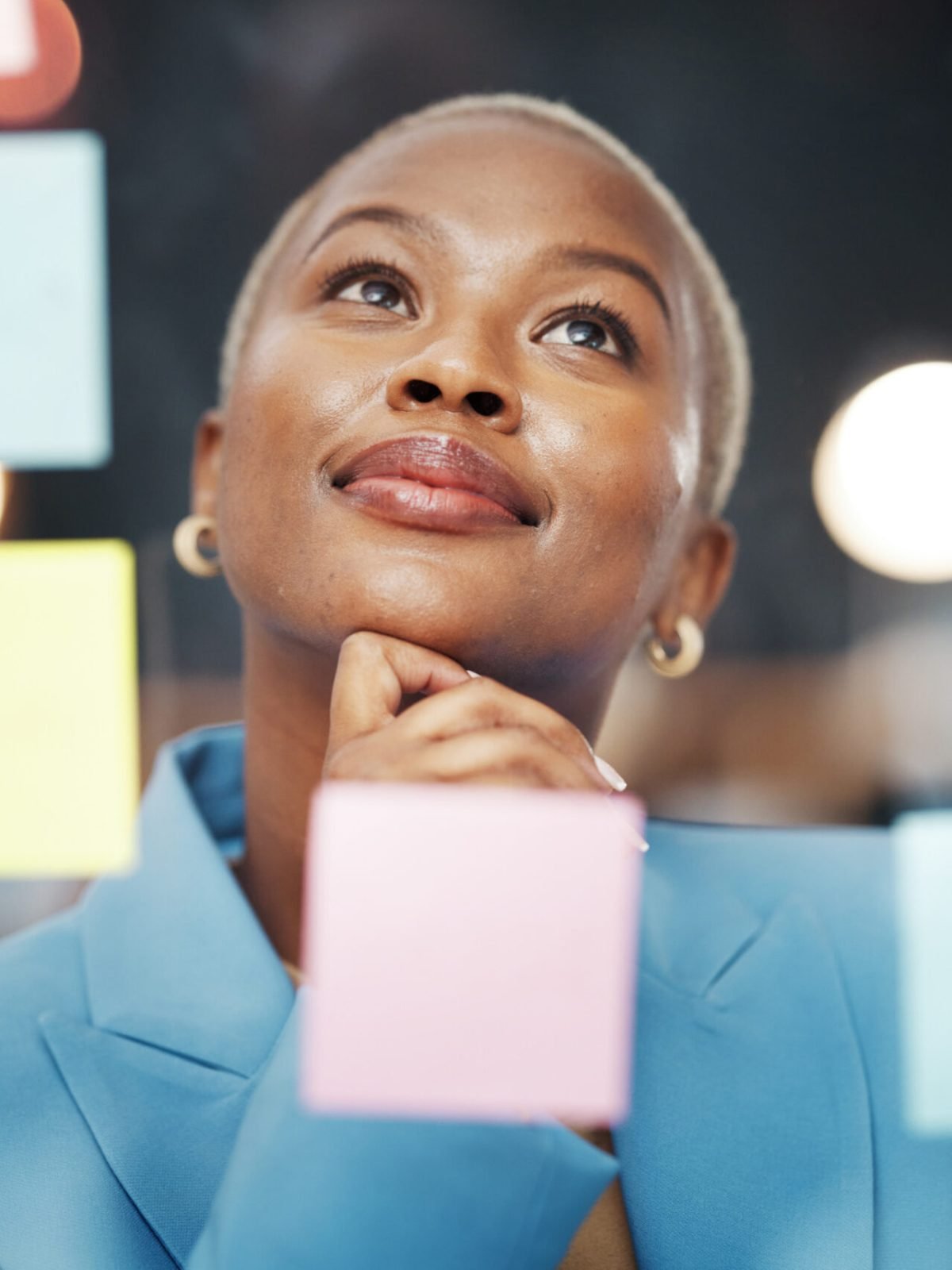 Vision, thinking and black woman with schedule, planning and agenda, sticky notes and bokeh background. Idea, face and female leader with goal, visual and problem solving, calendar and management.